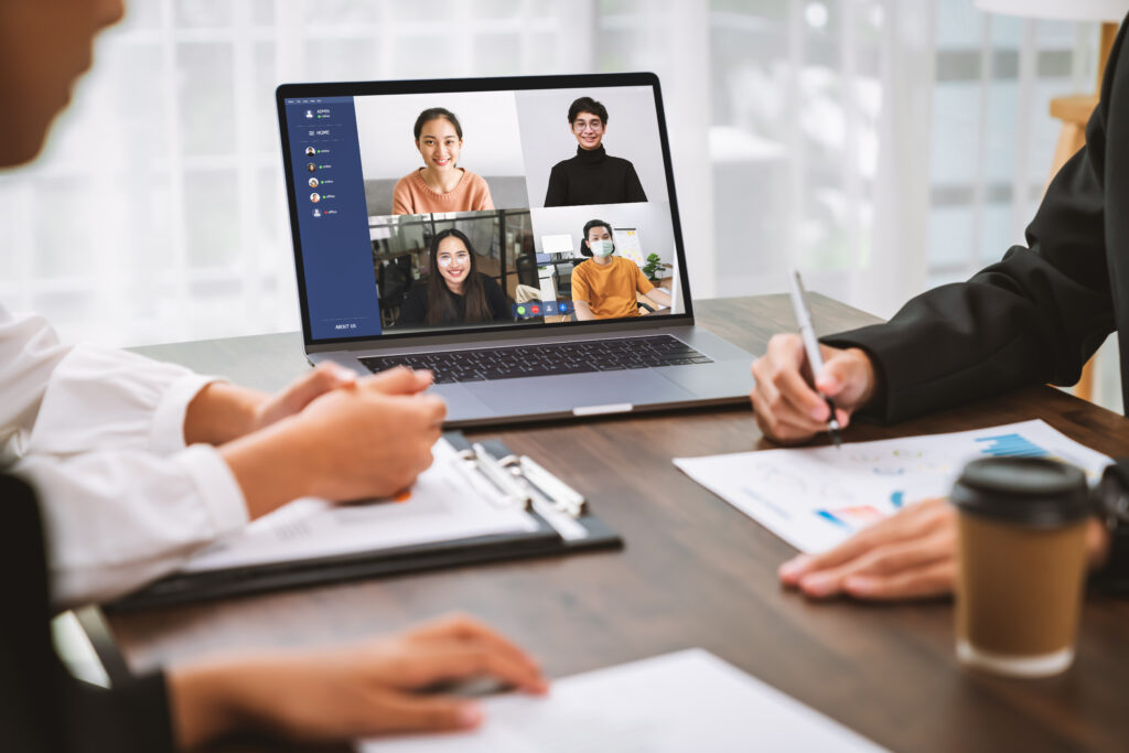 Business people using laptop on table with making video call meeting to team online and present work projects. Concept working from home.